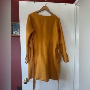 Beautiful saffron, mustard yellow linen dress with a sash attached.